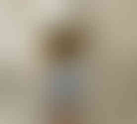 Olay Sensitive Skin calming facial Moisturizer consistency. A medium consistency cream is shown on the finger.