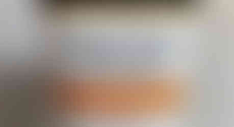 Neutrogena Clear Face Sunscreen Lotion bottle against a marbled background