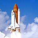The Space Shuttle Challenger launching f