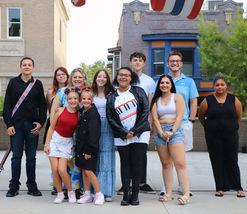 group of JAM students after a concert outside posing for camera