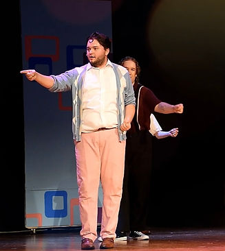 Three actors performing on stage