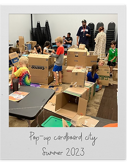 Kids playing with and building things out of cardboard boxes at one of our pop up museums