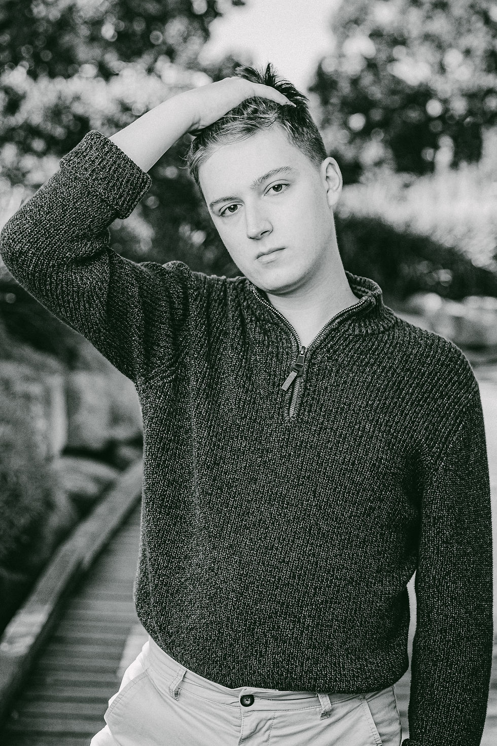 Black and white photo of a fashion model in a sweater