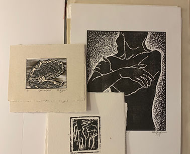 Printmaking examples of linoleum block prints of figures and objects