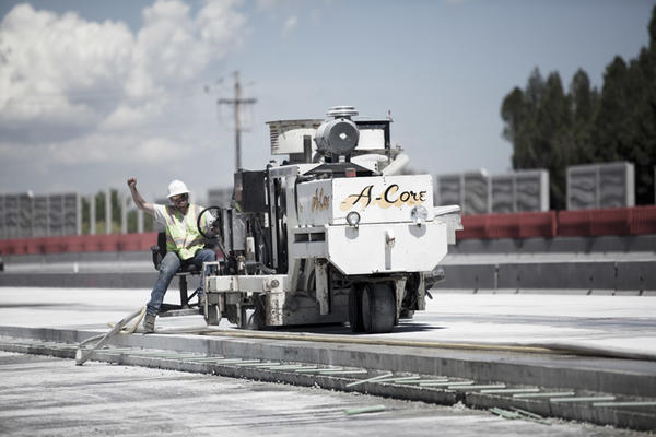 Worker Grooving Concrete