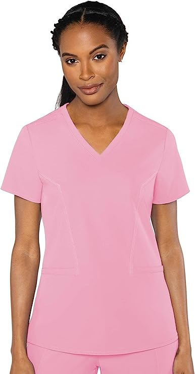 woman wearing light pink scrub top