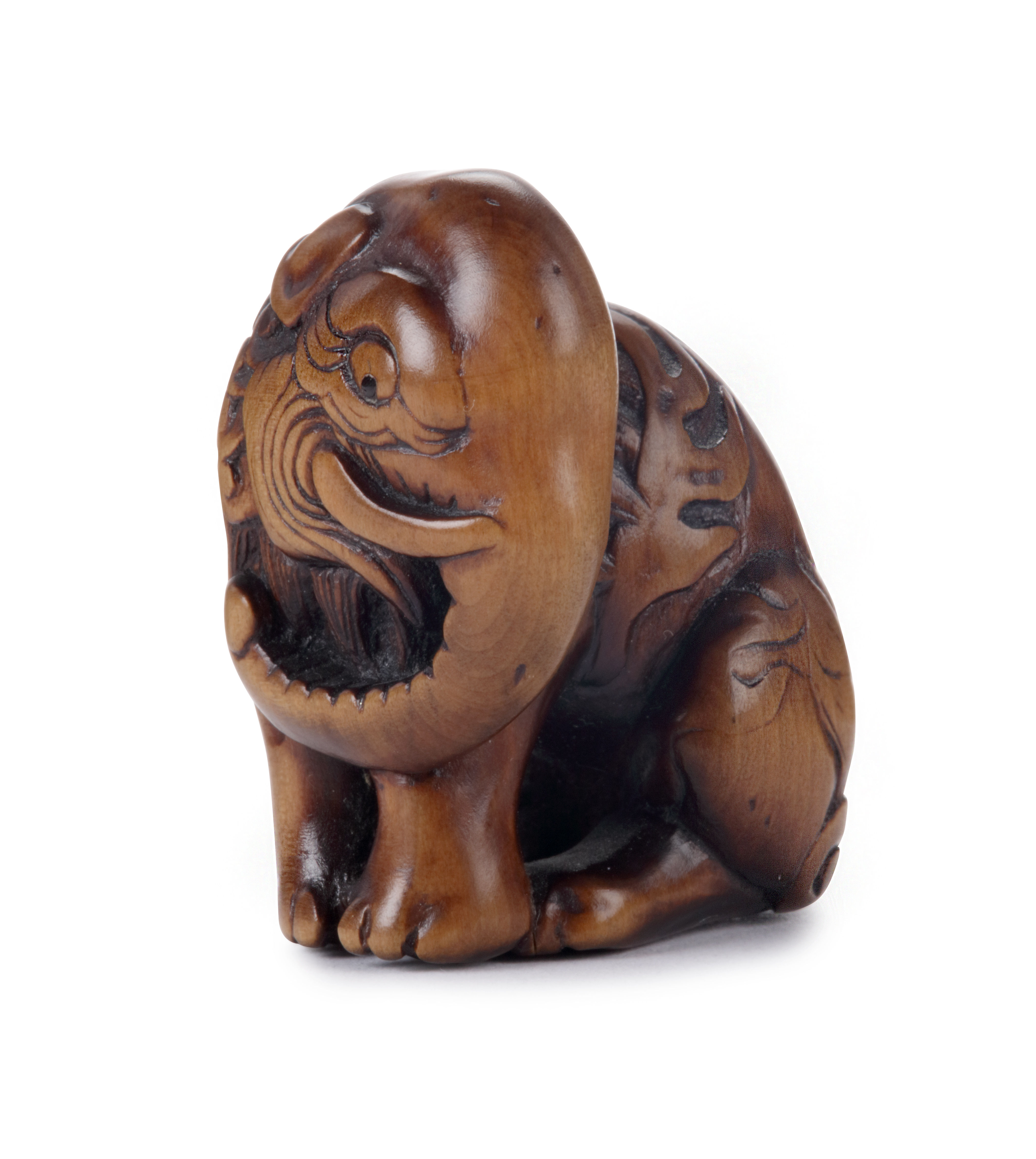A wood netsuke depicting Baku