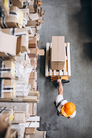 young-man-working-warehouse-with-boxes.jpg