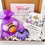 Thumbnail: Letterbox gift with a knitted bee in a purple organza gift bag, a purple sequin love heart and a gold bee pin badge on a flat card that reads I will always bee here for you