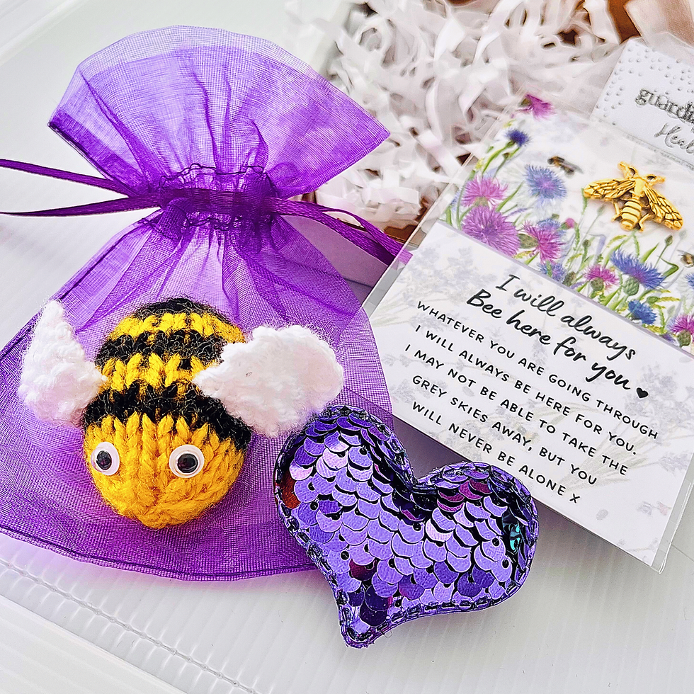 Thumbnail: Knitted bee on a purple organza gift bag, a purple sequin heart and a gold bee pin badge on a flat card that reads I will always bee here for you 