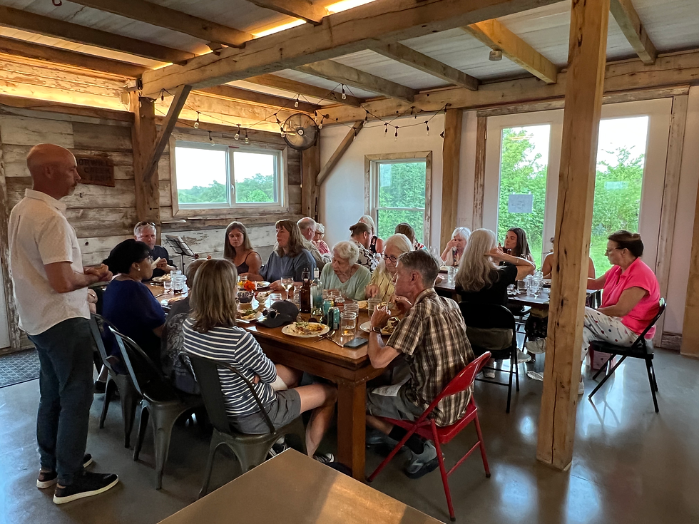 Me, talking to the crowd at our Peru to Iowa Dinner in our Barn.