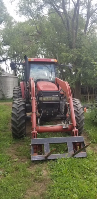 Red tractor with fixed wheel