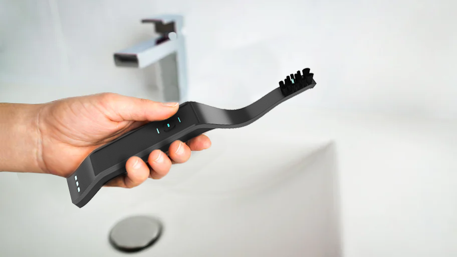 holding-electric-toothbrush-Recovered.png