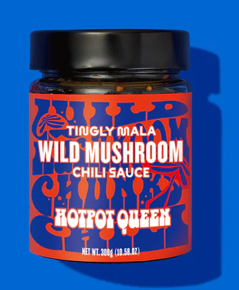 Jar of "Tingly Mala Wild Mushroom Chili Sauce" by Hotpot Queen on blue background. Bold red and blue label with playful fonts.