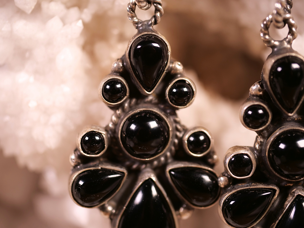 Thumbnail: Designed with a mix of oval, round, and teardrop stones, they create an elegant statement perfect