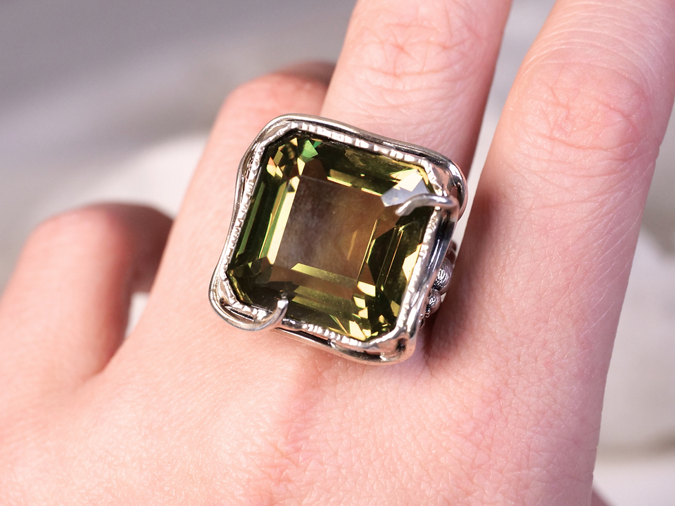 Thumbnail: comfortable band, bold setting, prong crown, corner crown, peridot meaning, peridot