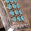 Thumbnail: This stunning silver belt buckle is adorned with 15 vibrant turquoise stones, each uniquely patterned with natural black vein