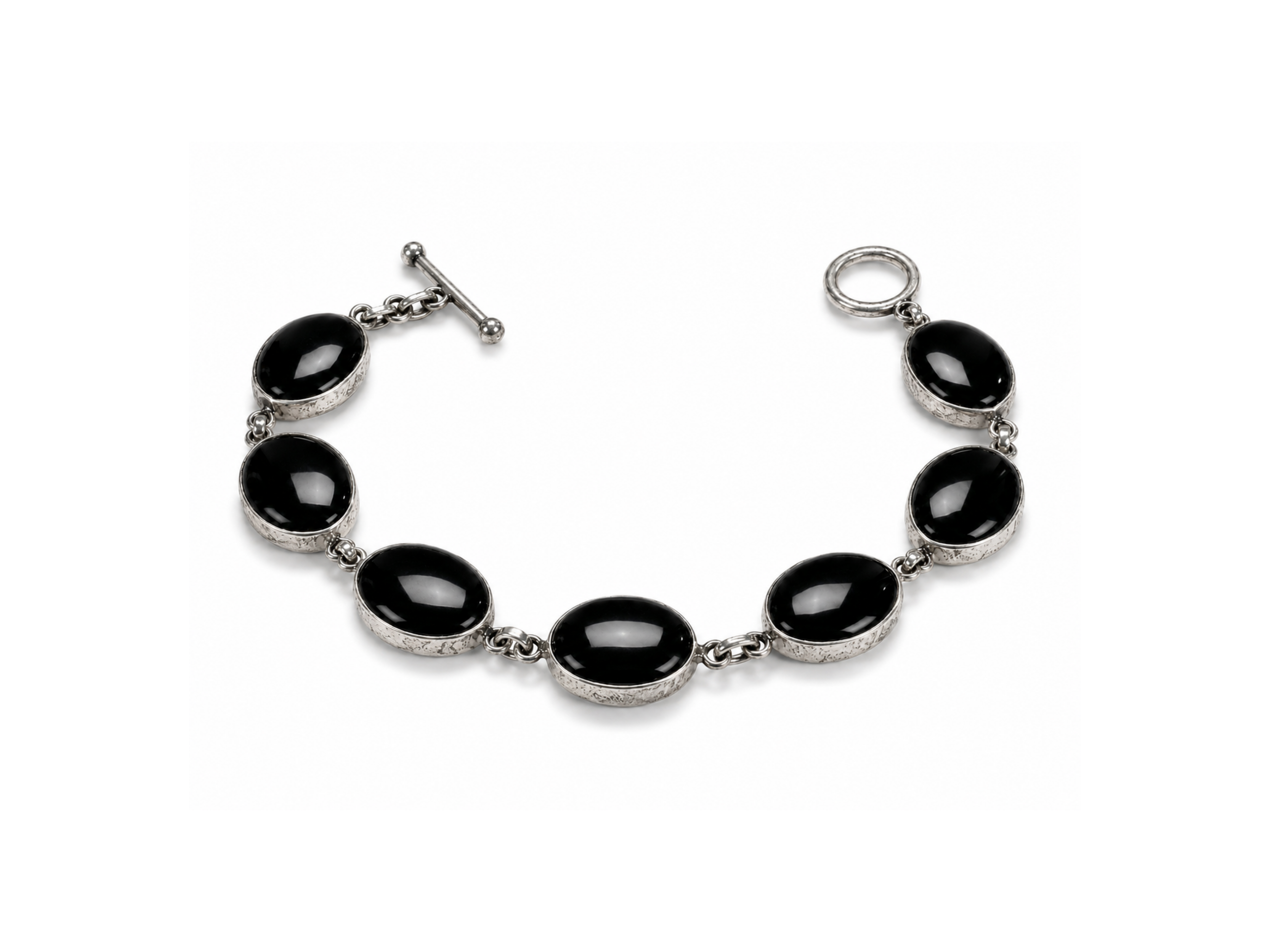 This sleek and elegant Black Onyx bracelet exudes timeless sophistication. The deep, polished black stones reflect a smooth,