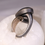 Thumbnail: spiral detail ring, curl detail ring, rolled edge band, bronze lined band, warm tone accents, cool tone metal, dark patina ri