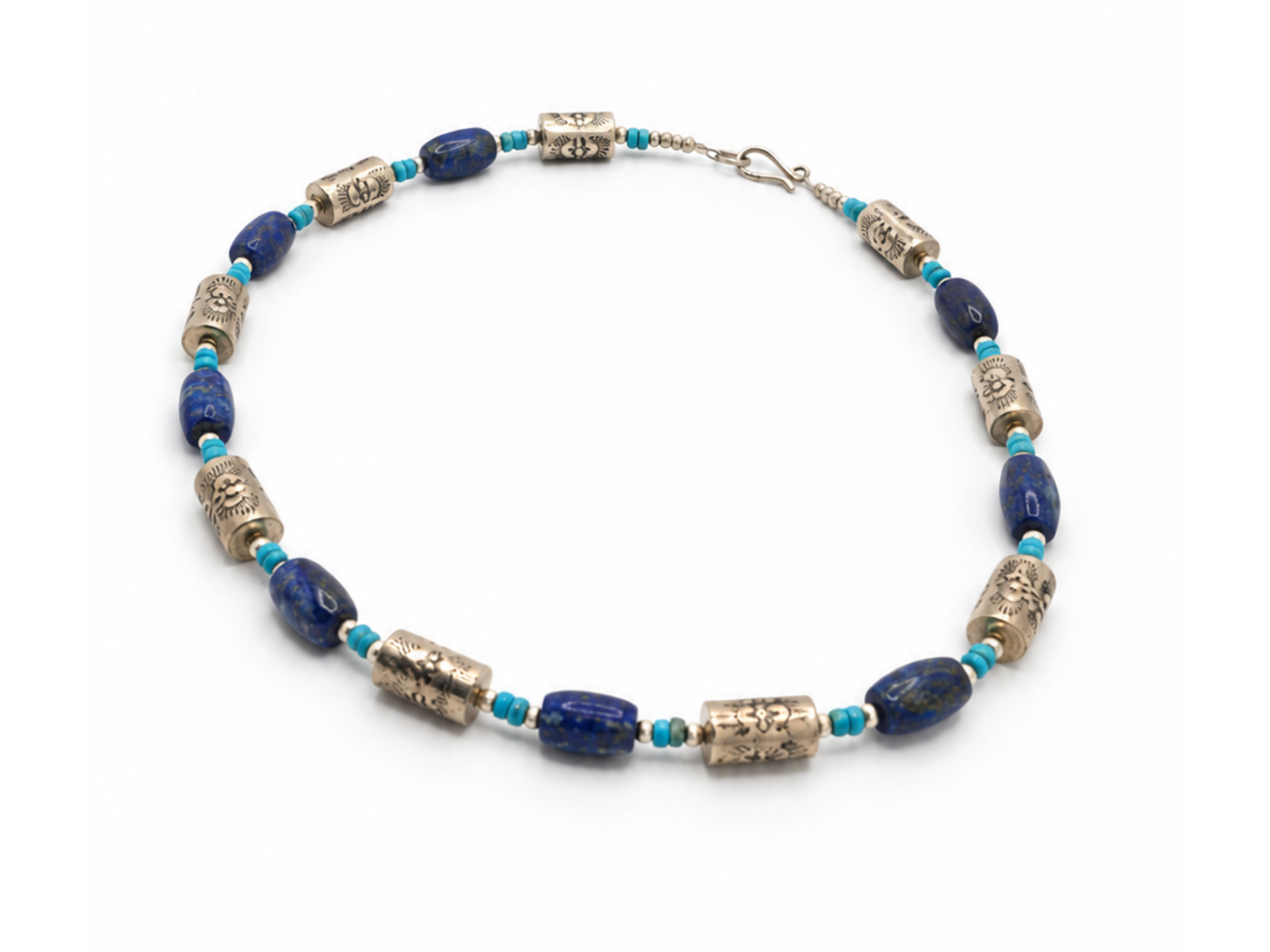 Deep blue lapis lazuli-style beads Turquoise-colored stone accents Decorative silver-tone barrel beads inspired by Navajo pea