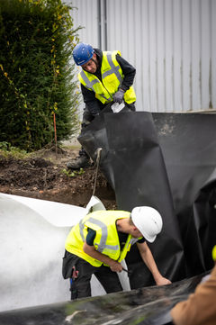 JCA bv - Transport Desmet - regenwatersysteem met infiltratiekratten Q-Bic Plus - bufferen water - Agru HDPE Zwart