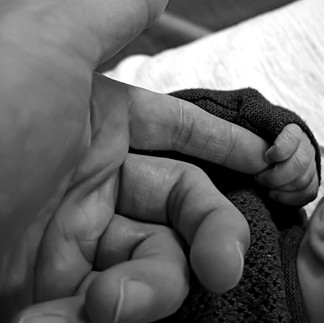 My Son holding my hand after he was born.