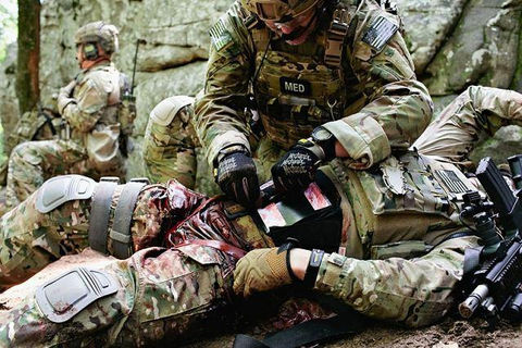 WeAreEMSSpecial-Operations-Combat-Medic-applying-tourniquet-on-wounded-warrior.jpeg