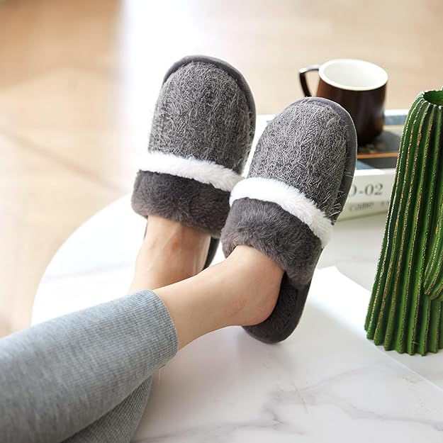 gray slippers on ladies feet