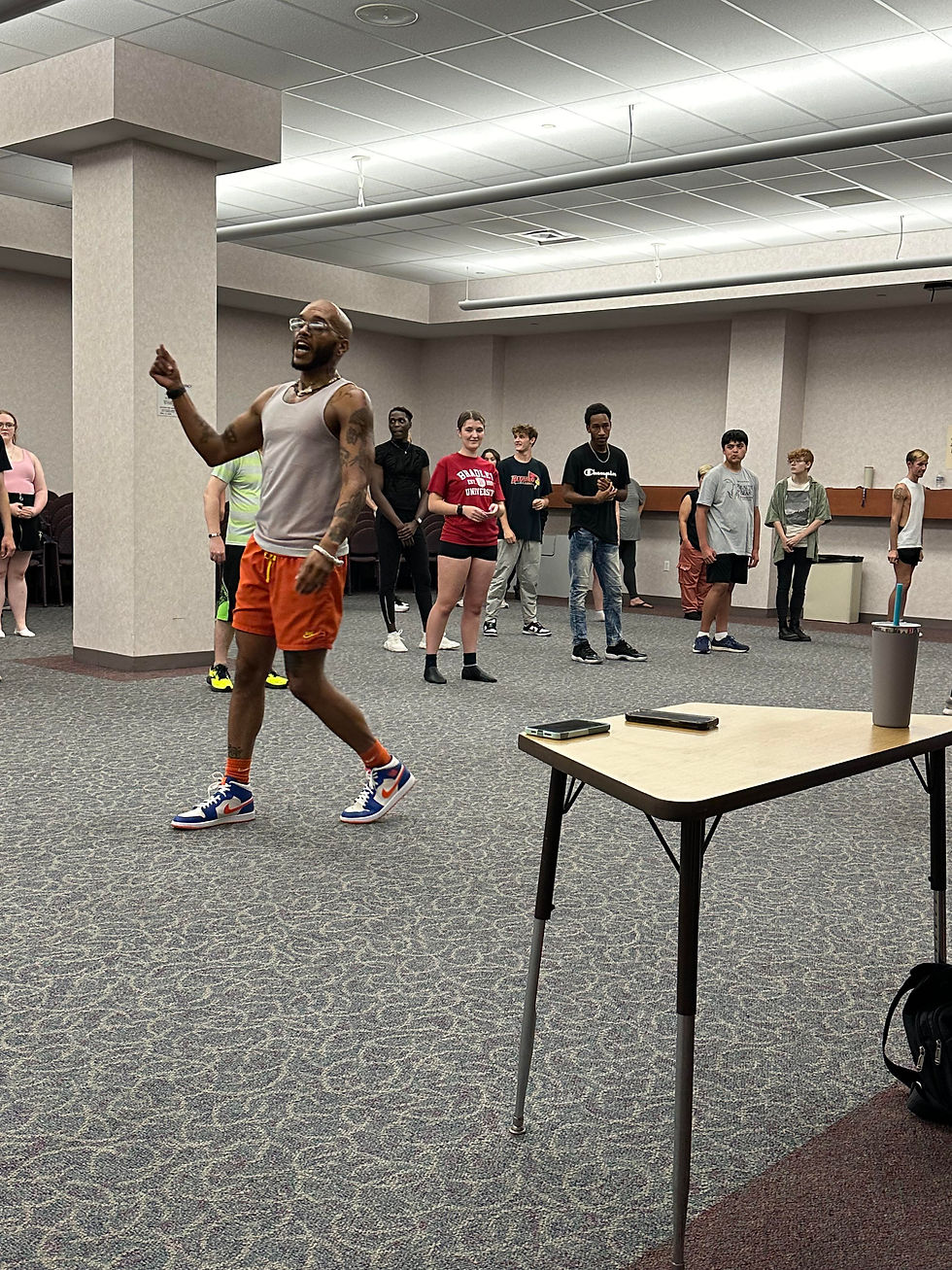 Choreographer teaching dance moves at Decatur Underground Theater's muscial workshop for Spongebob Squarepants.