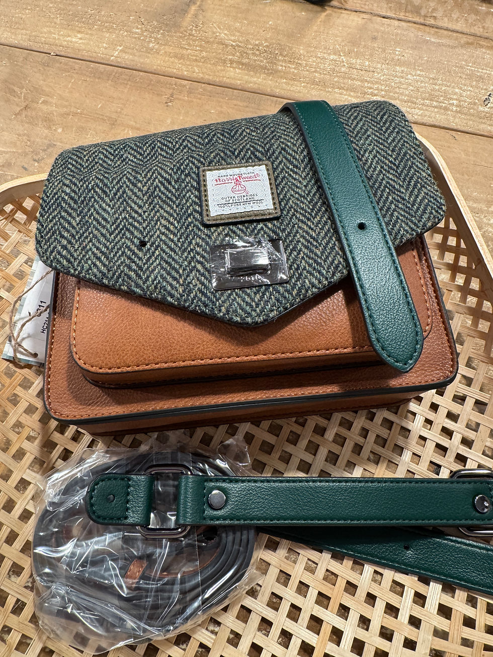 Purse making workshop at Islander Edinburgh. Green tartan and leather purse pieces.