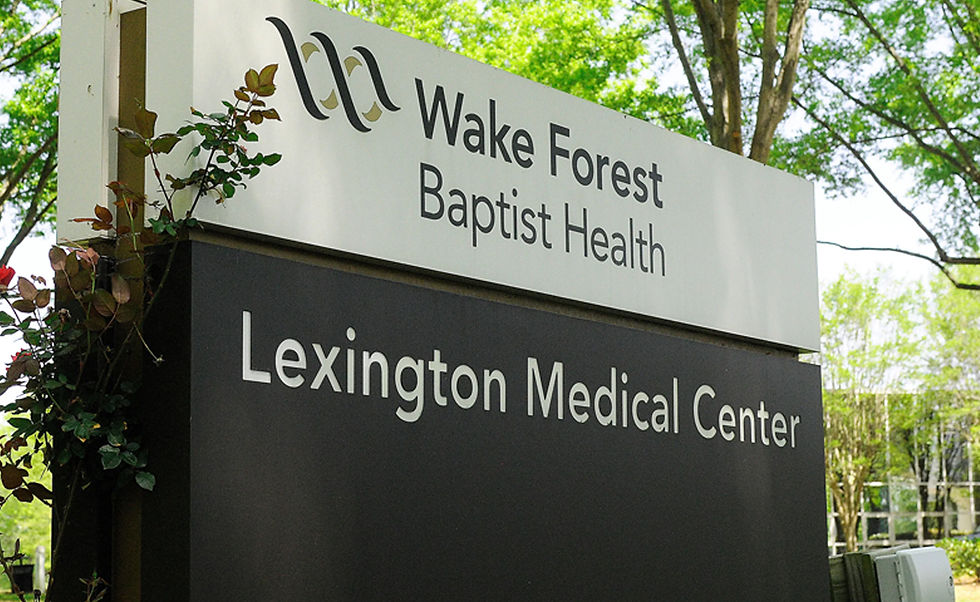 The sign for Wake Forest Baptist Health Lexington Medical Center, which is part of the Atrium Health system.