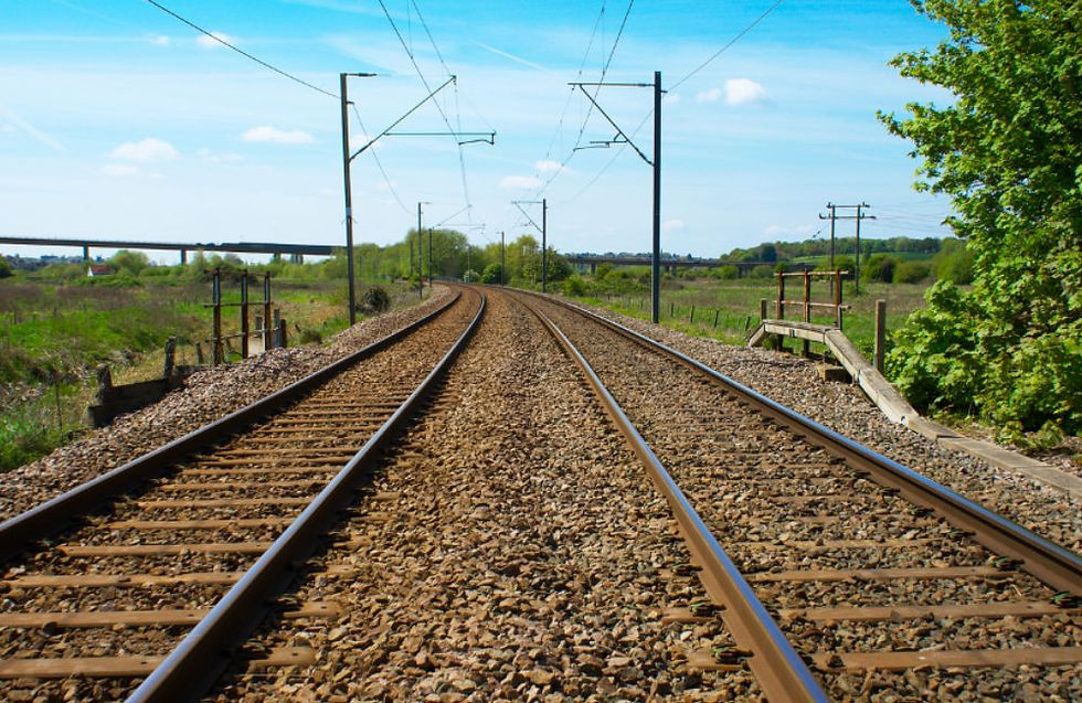 Railroad tracks and a big blue sky