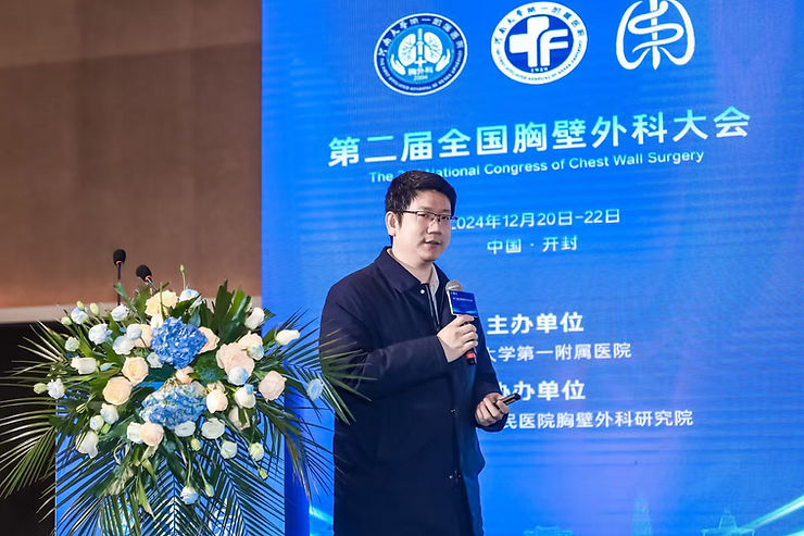 Dr. Weiguang Long is giving a speech.