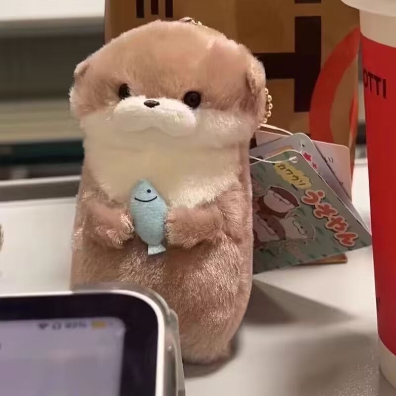 Thumbnail: Mini Otter Plush Keychain – Cute Otter Holding Fish Plush (Pocket-Size Gift)