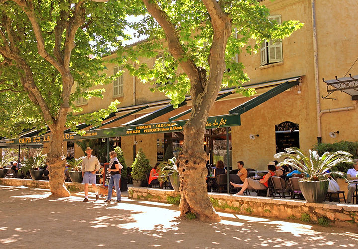 Visitors exploring the historic district of Cannes, home to elegant architecture and film festival landmarks