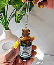 Salicylic Acid Serum with a hand squeezing the dropper