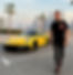 Joel Nikanor Vuorinen, The King of Supercars from Easy Go Car Export, posing in front of a BRABUS Rocket Porsche 911 at Palm Jumeirah, with the Dubai Marina skyline in the background.