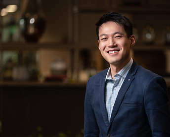 A photo of ADRIAN FU in a suit