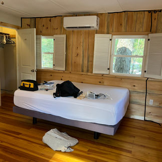Before picture of Airbnb living and bedroom undecorated