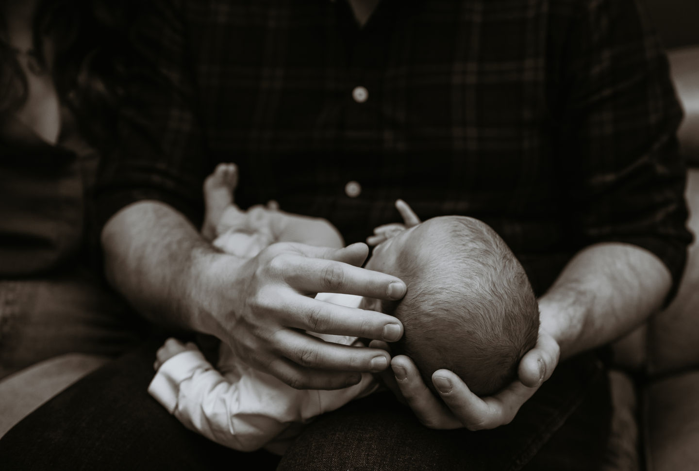 Baby being holding by daddy