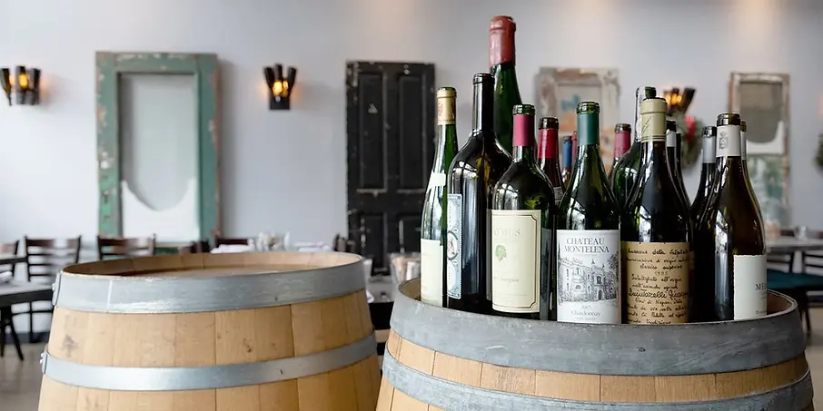 wine bottles on a barrel