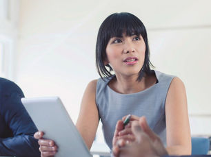 Decision-Making Done. When decisions are made efficiently. Woman at meeting.
