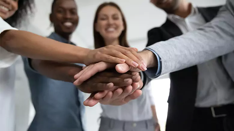 Team Accountability People stacking Hands