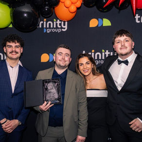 Trinity Group fundraising team members at an awards event, representing legitimate face-to-face fundraising and answering “is door-to-door fundraising a scam?”