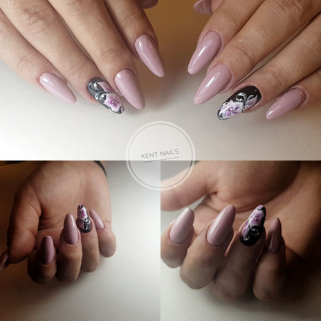 Soft lilac almond-shaped gel nails with hand-painted black and pink floral accent art at Kent Nails in Canterbury
