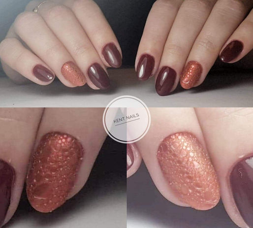 Short burgundy gel nails with copper glitter accent nails at Kent Nails in Canterbury

