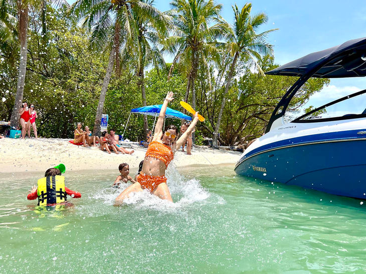 boat party island miami, friends having a blast at monument island during a boat tour.jpg