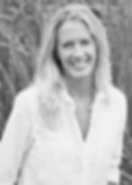 woman with long blonde hair smiling