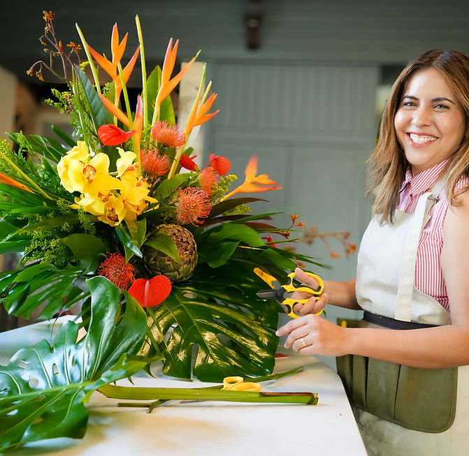 Florist with showstopper flower arrangement in Gather Round Bath