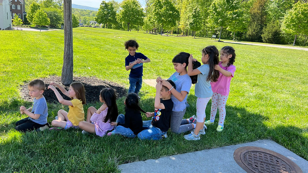 Fifi's Creative Kids Center's kids playing together on a park